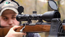 A Man Using Alpen Apex 4.5-27x50mm Riflescope Outdoors
