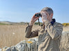 A Man Using Kowa BDII-XD 10x32mm Prominar Roof Prism Wide Angle Binocular