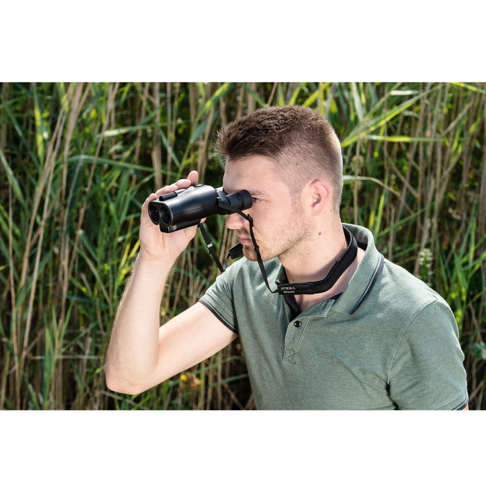 A Man Using Vixen ATERA H12x30mm Image Stabilized Binoculars Outdoors