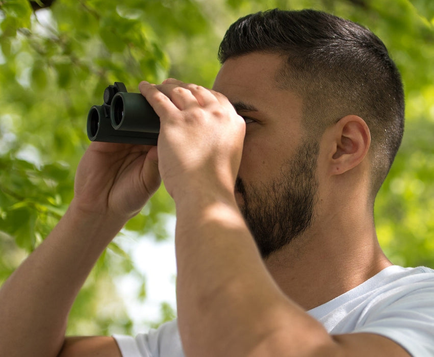 A Man Using the Carson RD Series 8x26mm Binoculars 