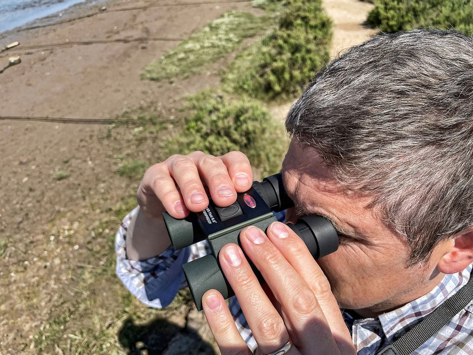 A Man Using the Kowa SV II 8x25mm Binocular Outdoors