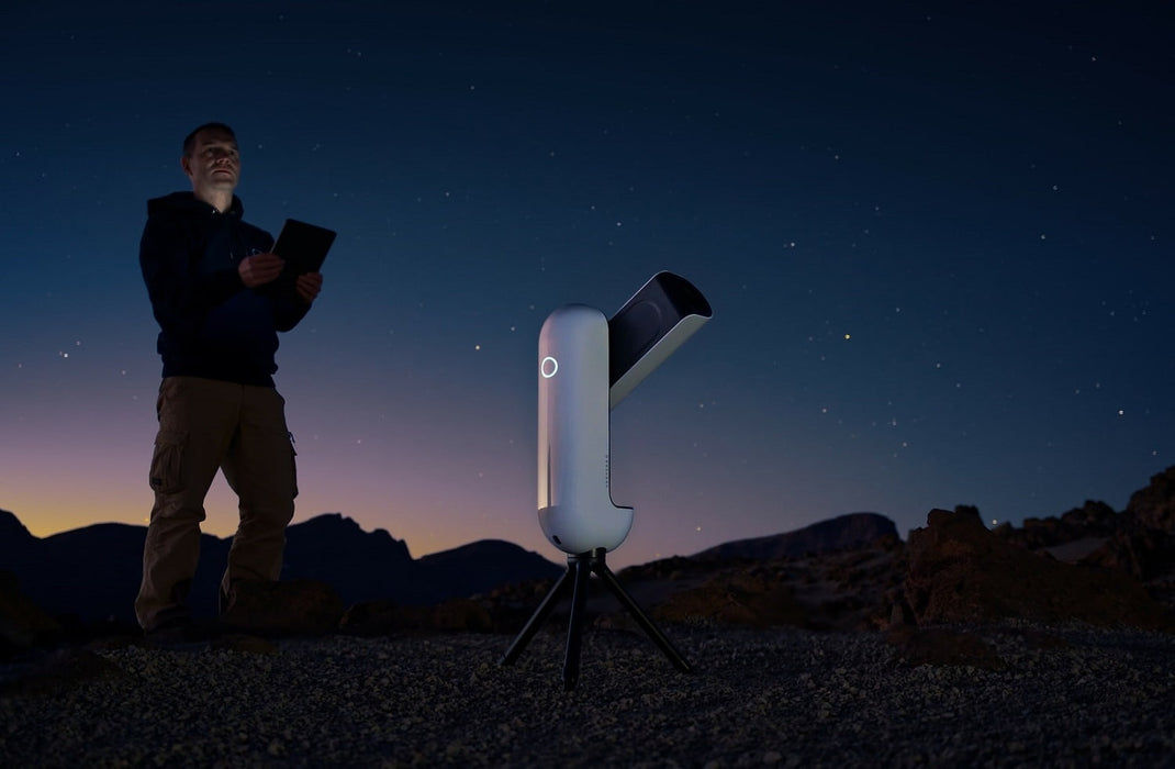 A Man Using the Vaonis Vespera II Smart Telescope for Astrophotography