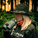 A Woman Holding Alpen Apex XP 10x42mm ED Laser Rangefinder Binoculars Outdoors