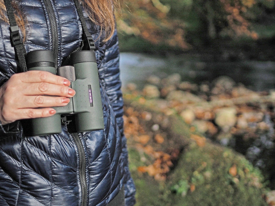 A Woman Holding Kowa Genesis 33 8x33mm Prominar XD Binocular 