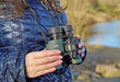 A Woman Holding Kowa YF II 6x30mm Porro Prism Binocular Outdoors