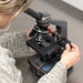 A Woman Using Carson Intermediate 100x-1000x LED Compound Microscope with Mechanical Stage