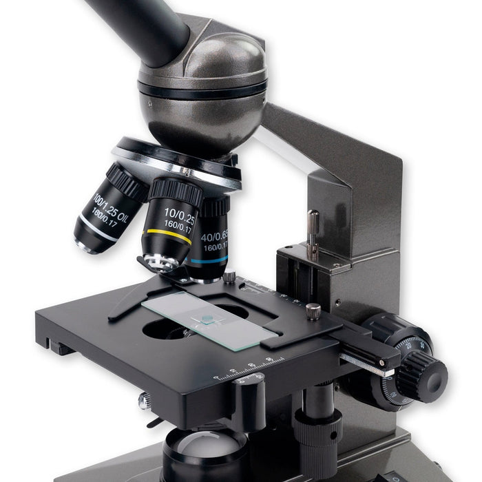 A Woman Using Carson Intermediate 100x-1000x LED Compound Microscope with Mechanical Stage Body