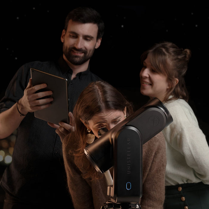 Group of People Using Unistellar Odyssey Pro Smart Telescope Eyepiece