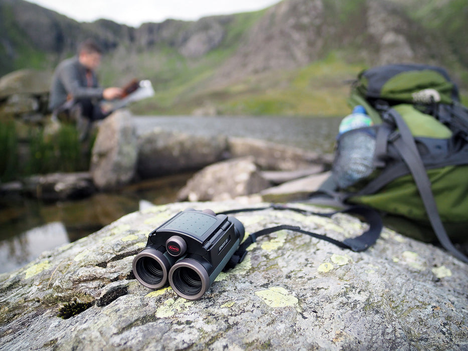 Kowa Genesis 22 10x22mm Prominar XD Binocular Lying on a Rock Outdoors