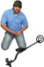 A Man Beside the Bounty Hunter Quick Draw II Metal Detector Bundle with Pin Pointer and Carry Bag