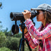 A Woman Using Barska 20-60x65mm WP Level Straight Spotting Scope Outdoors